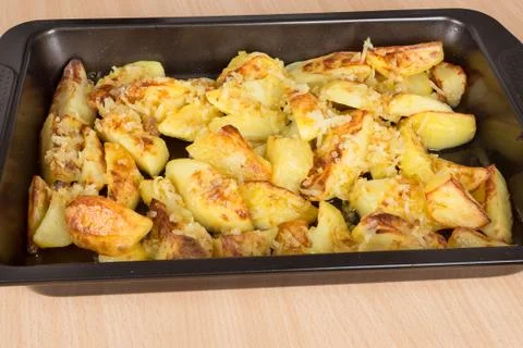 Fried potatoes on a baking sheet Stock Photos