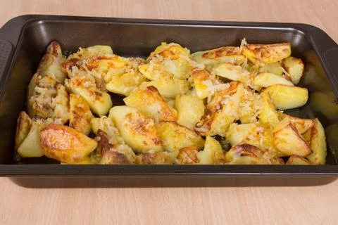 Fried potatoes on a baking sheet Stock Photos