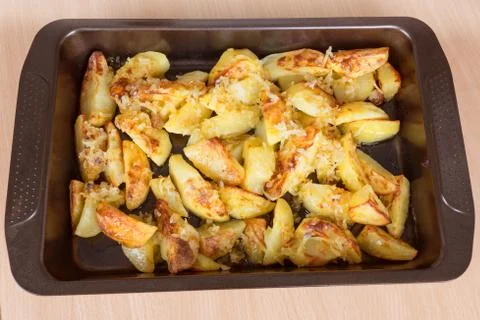 Fried potatoes on a baking sheet Stock Photos