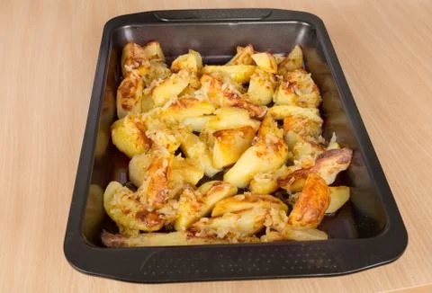 Fried potatoes on a baking sheet Stock Photos