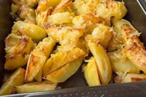 Fried potatoes on a baking sheet Stock Photos