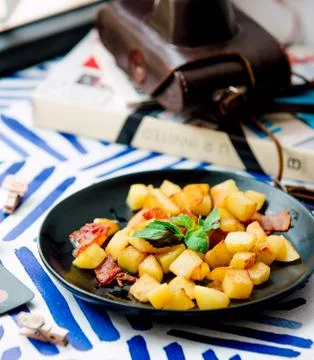 Fried potatoes with becon Stock Photos