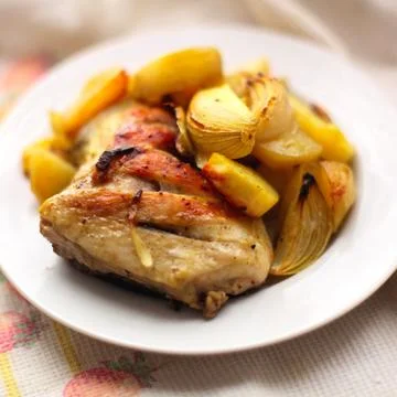 Fried potatoes with chicken 库存照片