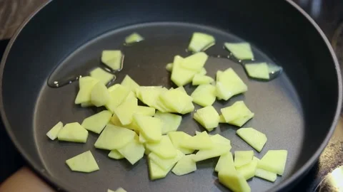 Fried potatoes close-up in a pan at home. Young potatoes are fried in a pan Stock Footage 163248926