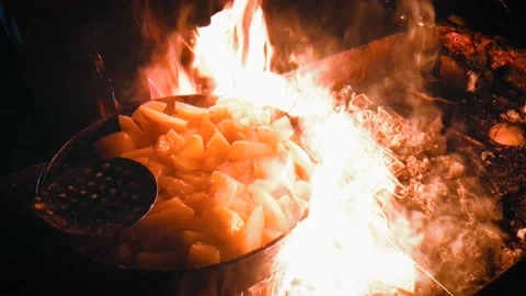 Fried potatoes on the fire pan barbecue stirring flipping Stock-Footage 211807724