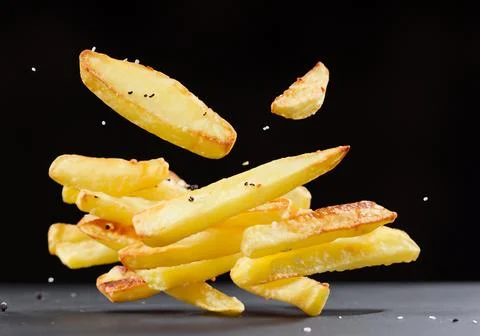 Fried potatoes flying Stock Photos