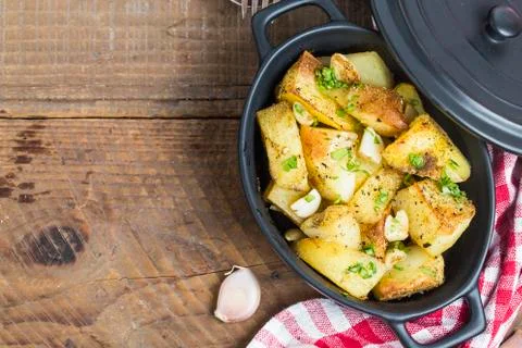 Fried potatoes with garlic Stock Photos
