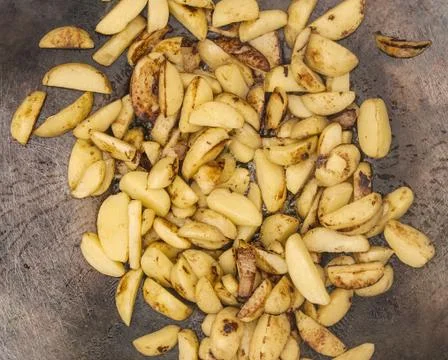 Fried potatoes on the grill Stock Photos