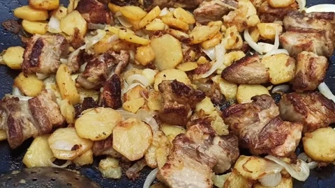Fried potatoes with meat Stock Footage 277495911
