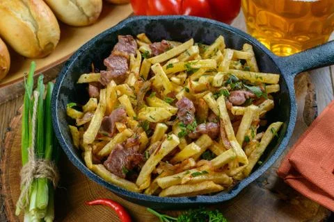 Fried potatoes with meat Stock Photos