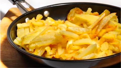 Fried potatoes in a pan Foto stock