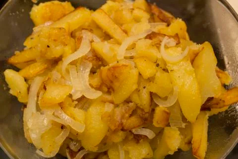Fried potatoes on pan Stock Photos