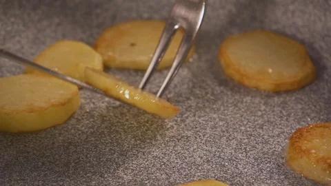 Fried potatoes in a pan slow motion Stock Footage 81816978