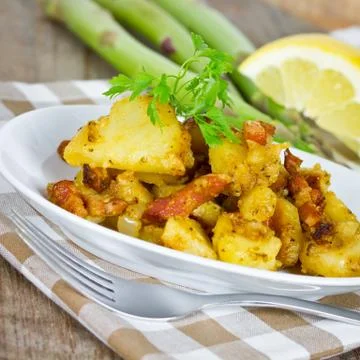 Fried potatoes Stock Photos