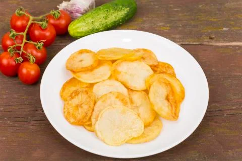 Fried potatoes Stock Photos