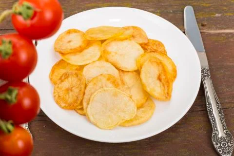 Fried potatoes Stock Photos