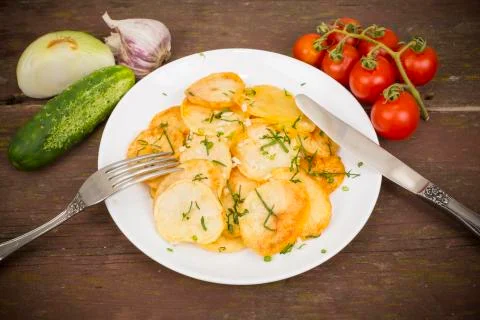 Fried potatoes Stock Photos