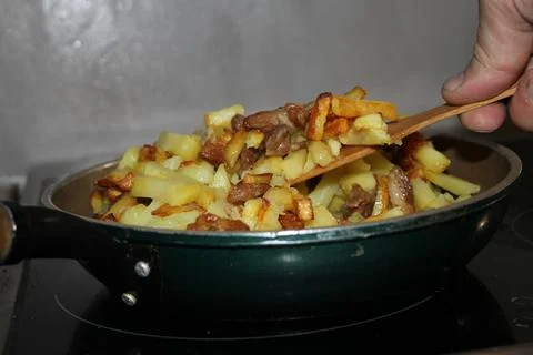 Fried potatoes Stock Photos