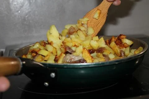 Fried potatoes Stock Photos