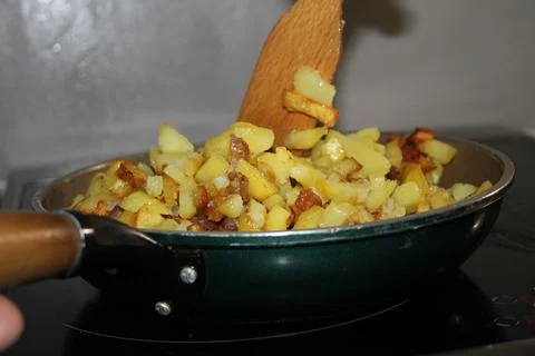 Fried potatoes Stock Photos