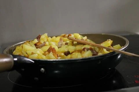 Fried potatoes Stock Photos