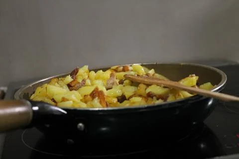 Fried potatoes Stock Photos