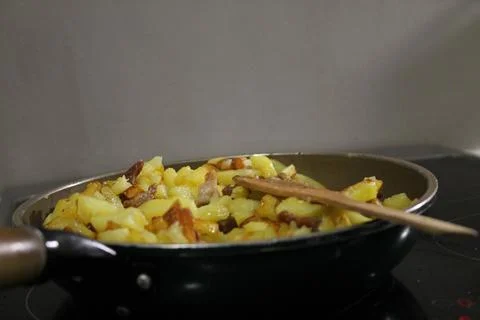 Fried potatoes Stock Photos
