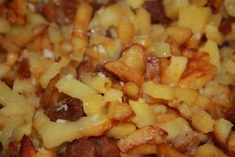 Fried potatoes Stock Photos