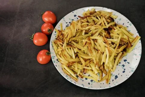 Fried potatoes Stock Photos
