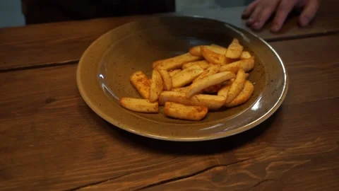 Fried potatoes on a plate Stock Footage 159882329