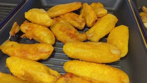 Fried potatoes with sausage or fish unhealthy food Stock Footage 310252265