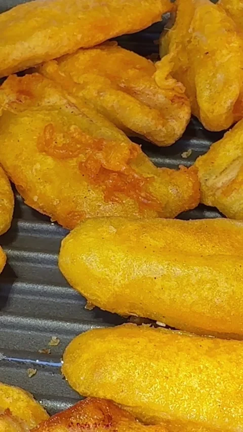 Fried potatoes with sausage or fish unhealthy food Stock Footage 310486678