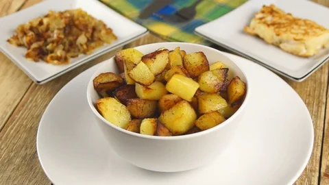 Fried potatoes in a white plate Stock Footage 108448333
