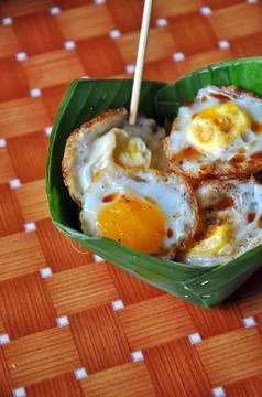 Fried quail eggs Stock Photos