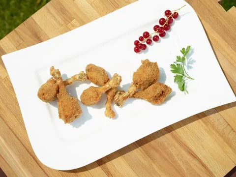 Fried quail legs Stock Photos