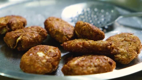 Fried Raw Koftas, pakoda for the vegetable Kofta curry an Indian Food, 4k footag Stock Footage 248490748