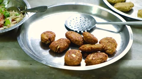 Fried Raw Koftas, pakoda for the vegetable Kofta curry an Indian Food, 4k footag Stock Footage 248490781