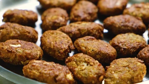 Fried Raw Koftas, pakoda for the vegetable Kofta curry an Indian Food, 4k footag Stock Footage 248490807