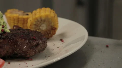 Fried rib eye steak on a plate, close up, sliding Vidéo 66042261