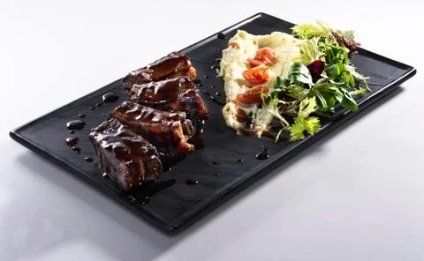 Fried ribs with mashed potatoes  isolated on white Stock Photos