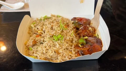 Fried rice and chilli chicken prepared in homemade Bengali style in Kolkata Stock Footage 312311394