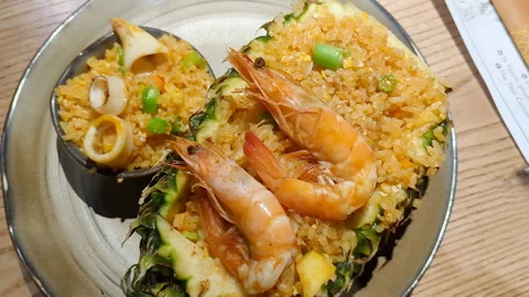 Fried rice and seafood in pineapple. Stock Footage 266869698