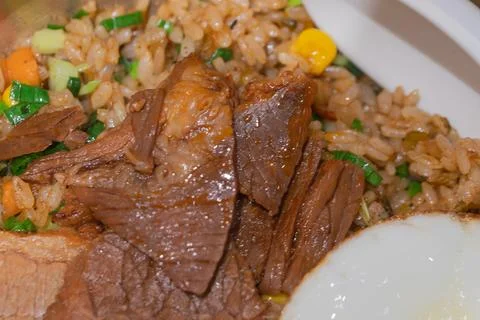 Fried rice with beef and a fried egg, chinese cuisine Stock Photos