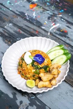 Fried rice with chilli and crispy fried sea bass Stock Photos