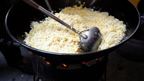 Fried rice cooking on big pan, HD slow motion Stock Footage 80906817