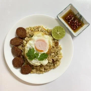 Fried rice with fried egg and Chinese sausage. Stock Photos