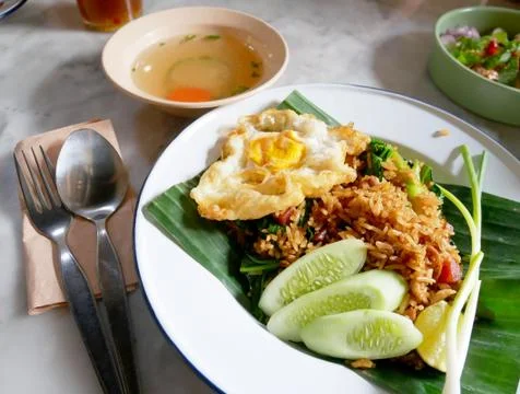Fried rice with fried egg served on a plate. Stock Photos