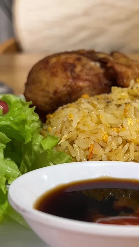 Fried rice with fried egg on top taken from the top corner Stock Footage 317705003
