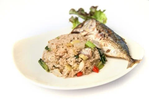 Fried rice with fried mackerel. Stock Photos