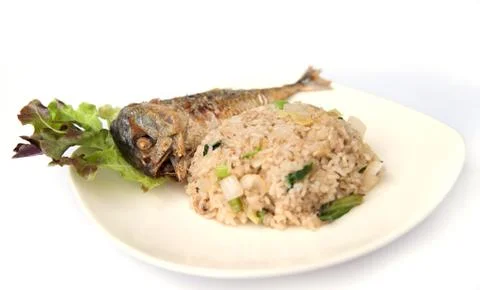 Fried rice with fried mackerel. Stock Photos